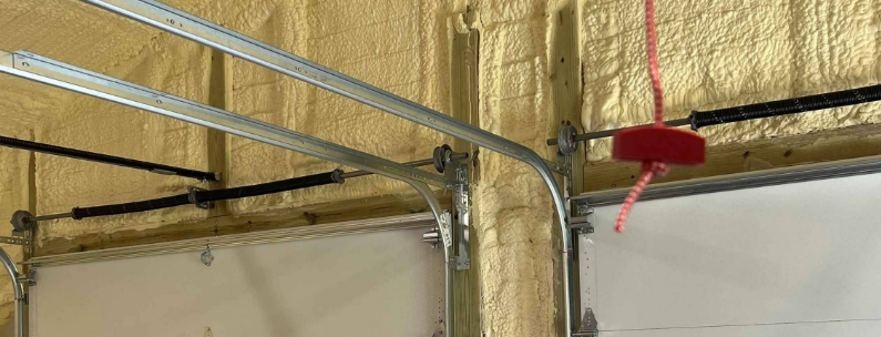 A skilled technician performing garage door track repair, ensuring smooth and safe operation for homeowners in Jupiter, FL.