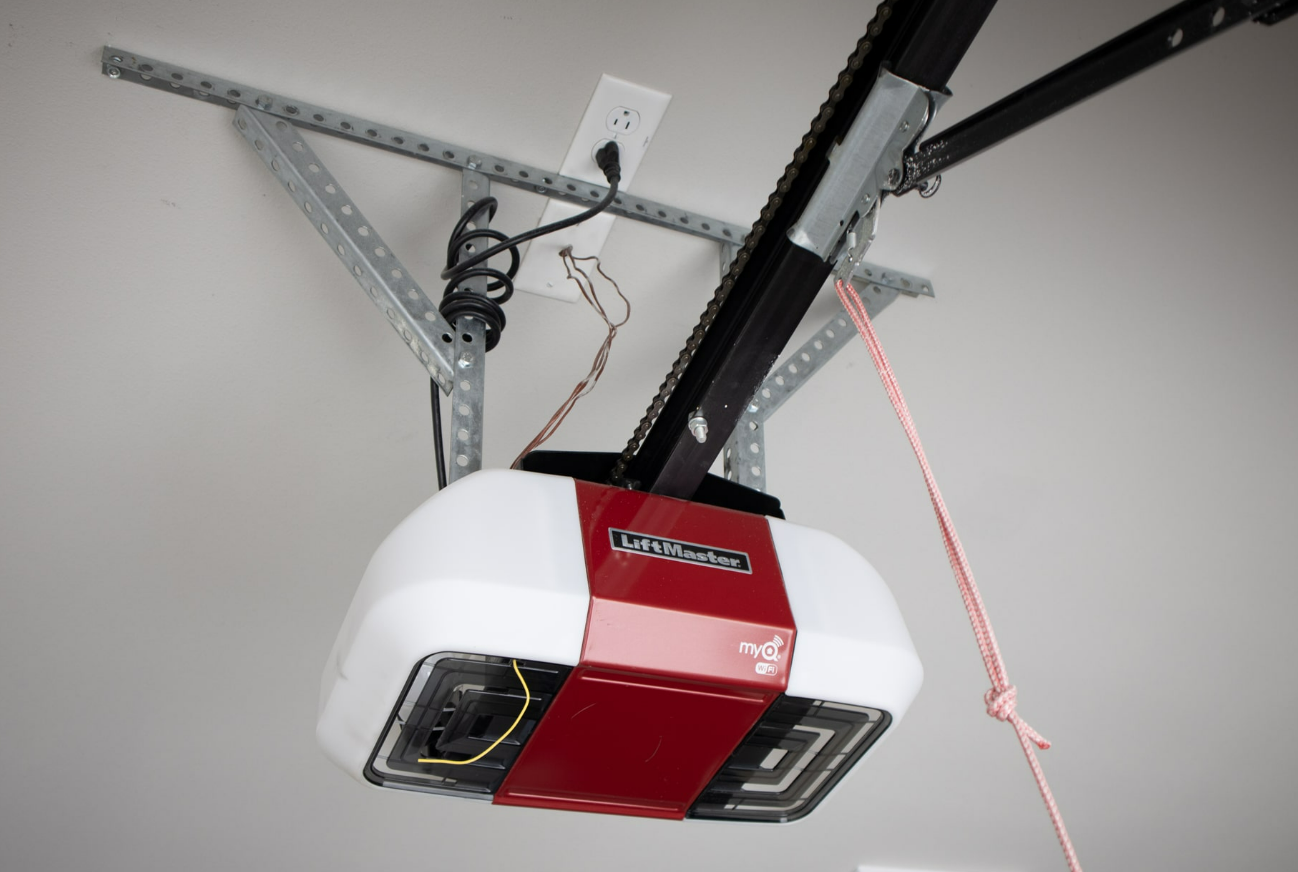 Professional technician repairing a garage door in Jupiter, FL, providing reliable and efficient garage door repair services.