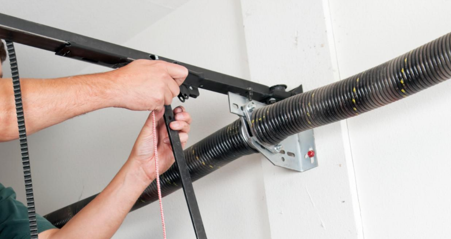 a technician expertly replacing a worn-out garage door spring with precision tools, highlighting the reliability and expertise of Garage Door Repair Services in Jupiter, FL. This visual emphasizes the company’s dedication to quality garage door spring repair services.