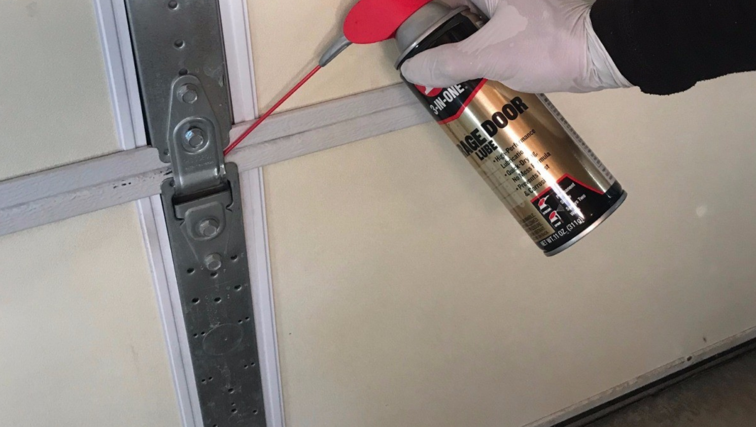 Technician fixing a noisy garage door in Jupiter, FL - Expert garage door repair services