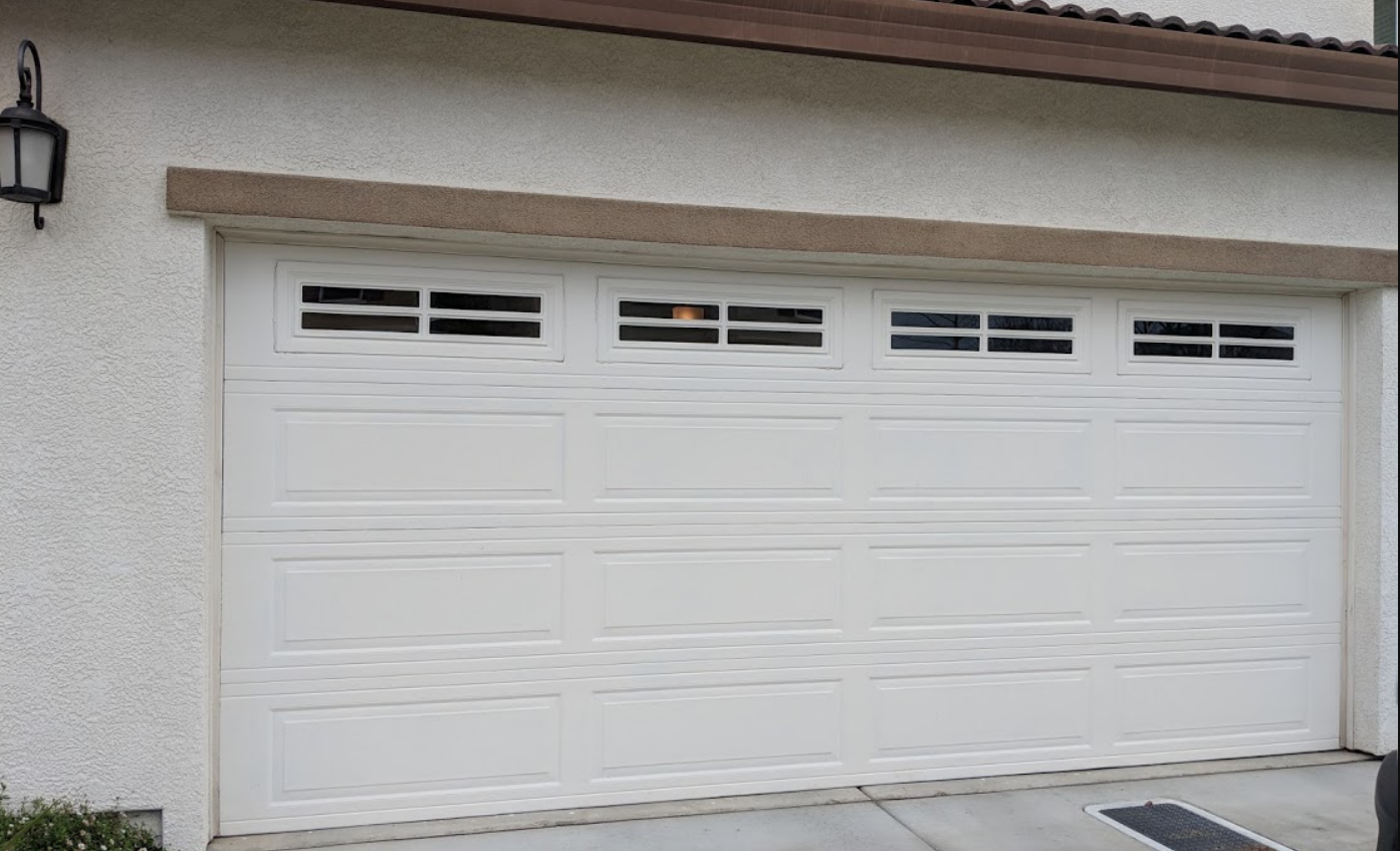 a technician providing same-day garage door repair service in Jupiter, FL