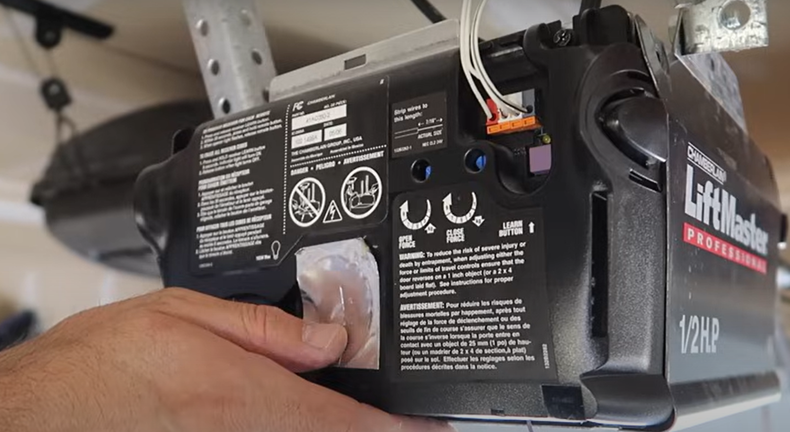 Experienced technician performing garage door opener repair in Jupiter, FL to ensure smooth operation and safety